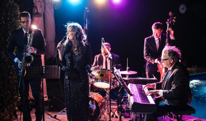 live band performing at a wedding by night