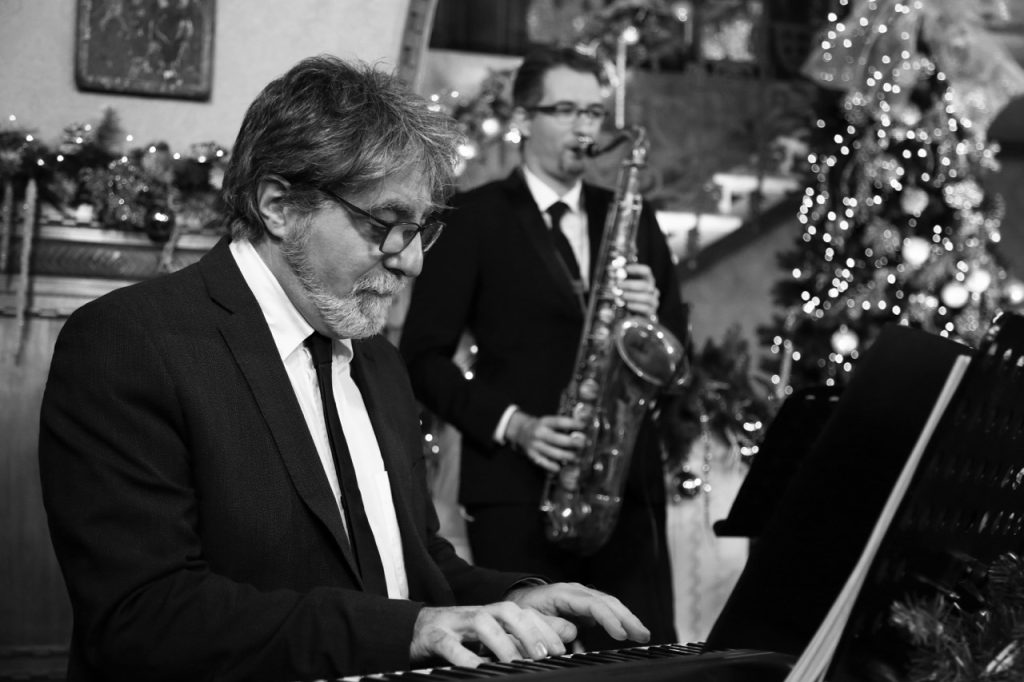 jazz pianist and saxophone player performing Christmas song