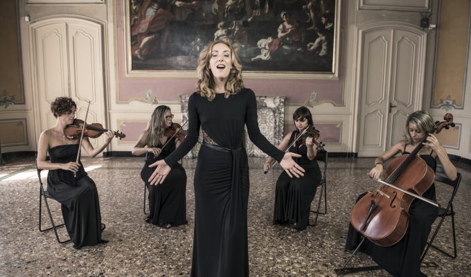 female singer and string quartet performing in a villa