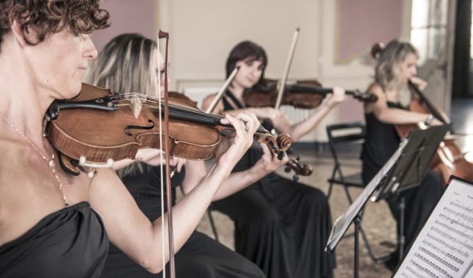female string quartet performing in a villa