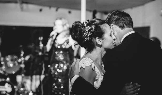 bride and groom first dance with a live singer