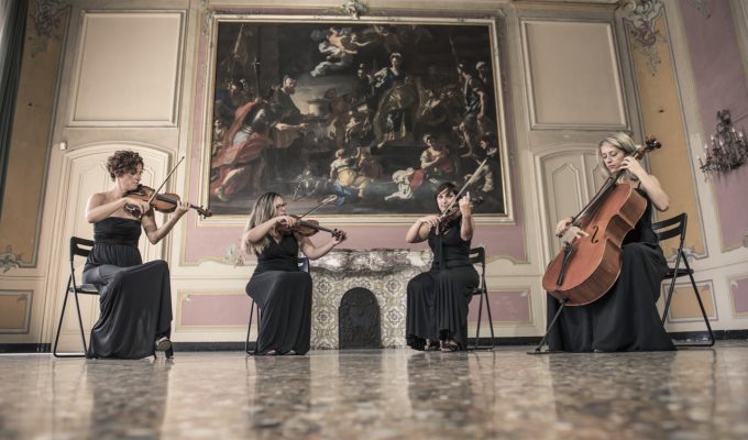 female string quartet performing in a villa